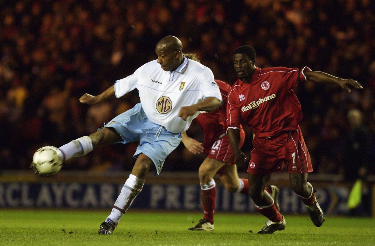 dion-dublin-of-aston-villa-strikes-the-ball-5cf6402a6796b00f6d000019.jpg