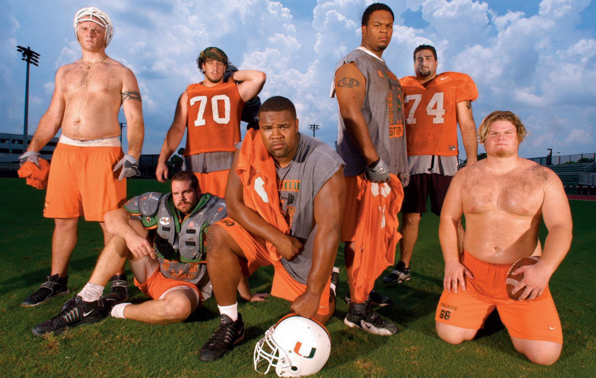 Vernon Carey (middle, kneeling) and the Canes offensive linemen.