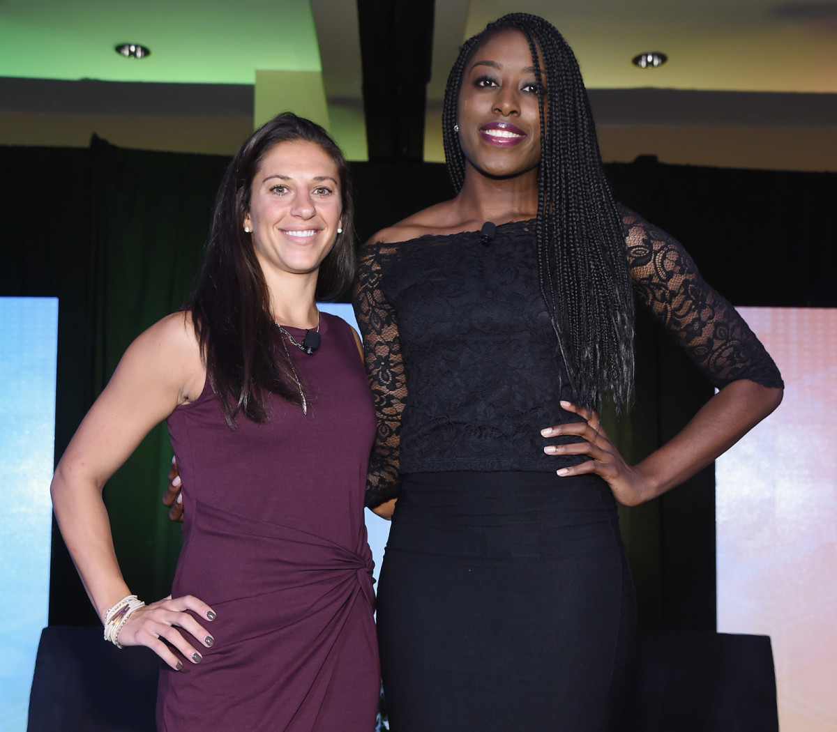 U.S. women's national team star Carli Lloyd stands with WNBA standout and players' association VP Chiney Ogwumike.