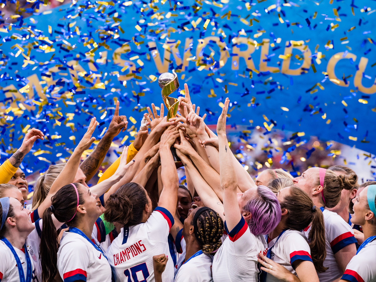 uswnt-hands-wwc-trophy.jpg