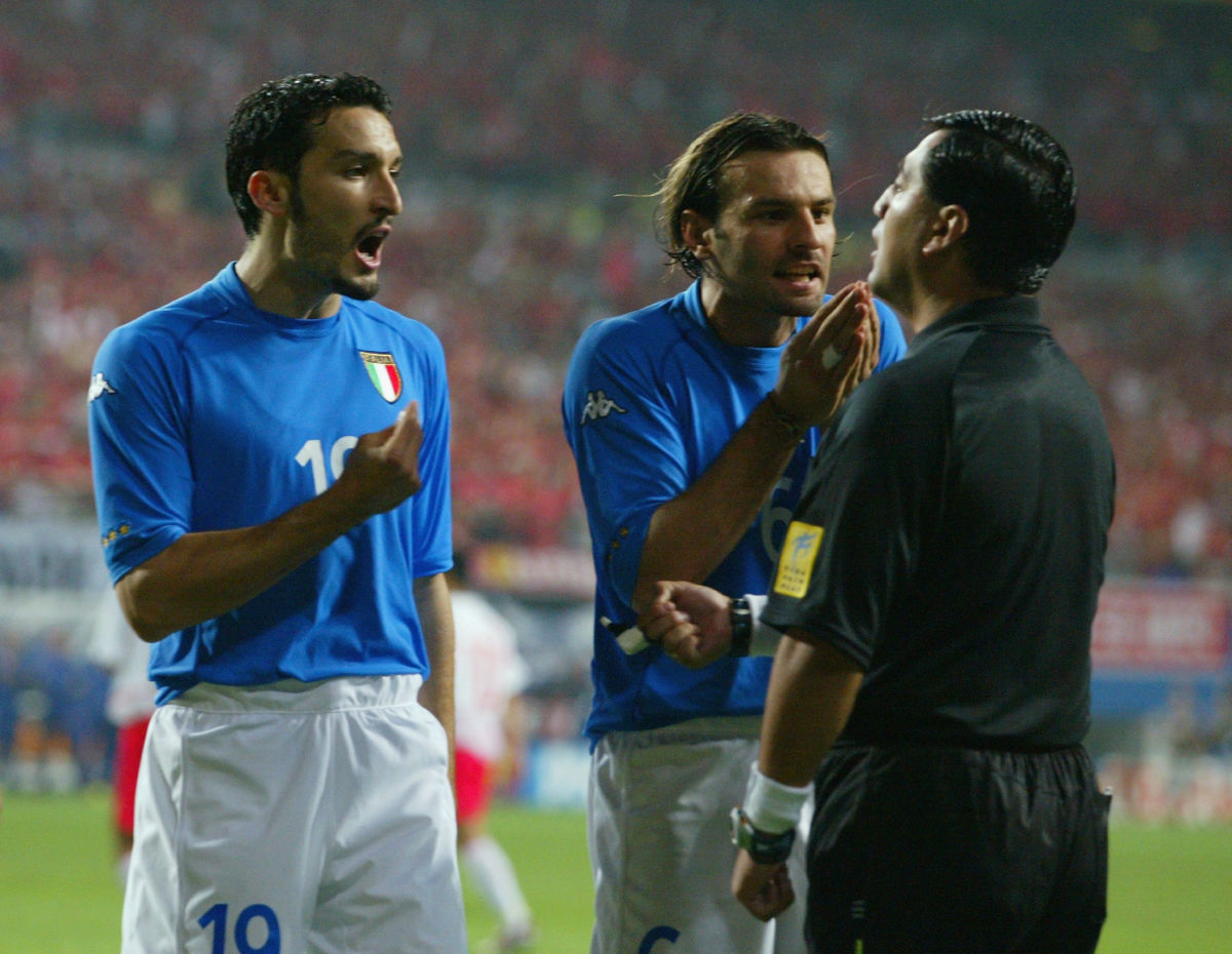 gianluca-zambrotta-left-and-cristiano-zanetti-right-of-italy-protest-to-referee-byron-moreno-of-ecuador-after-he-awarded-a-penalty-to-south-korea-5d0cc87e21eb6a4113000001.jpg
