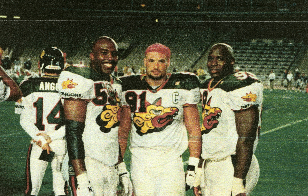 Naposki (center) with Barcelona Dragons teammates Juan Long (59) and La'Roi Glover (99).