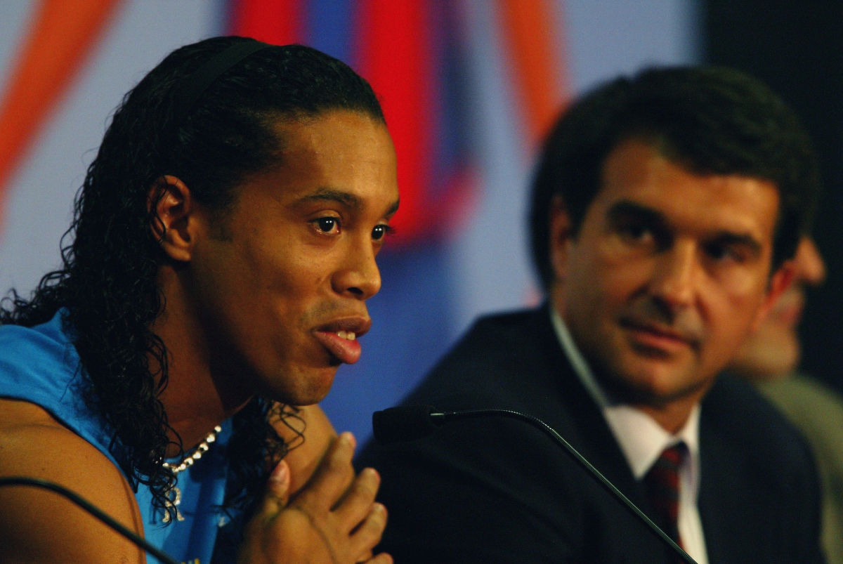 ronaldinho-of-brazil-with-the-president-of-barcelona-fc-joan-laporta-talking-to-the-press-5c93914fdfd9d36e4c000028.jpg