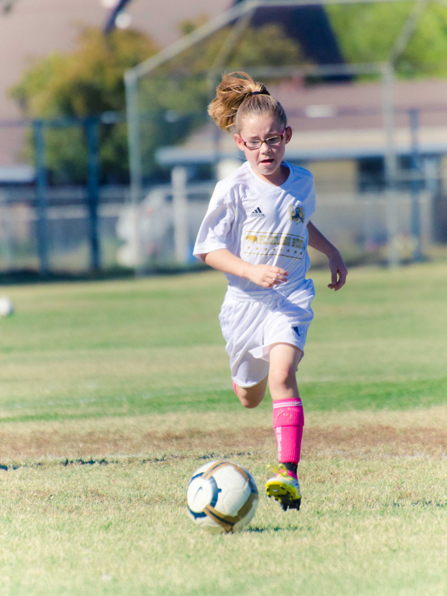 Olivia stood out at a young age, and by seven, she was playing two years up, trucking opponents with Golden State FC.