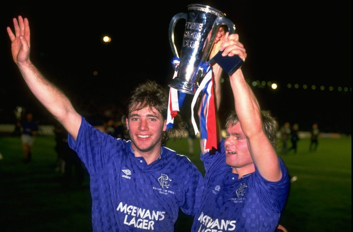 R Fleck and A Mccoist celebrate with the Skol Cup after the finals