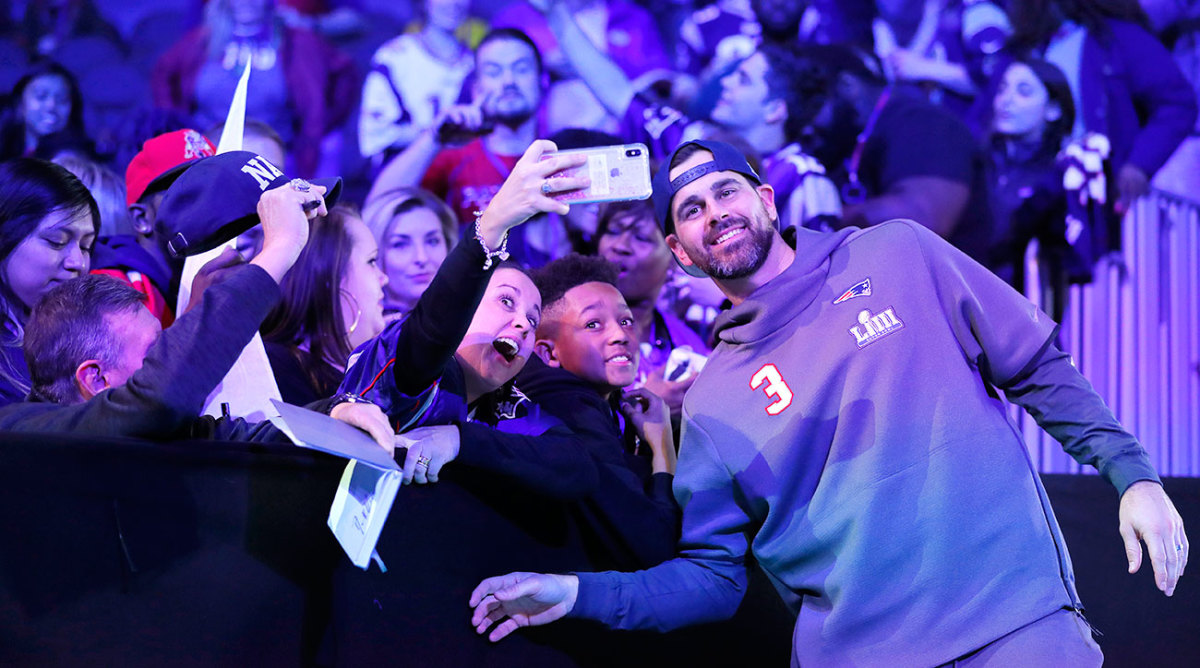 Patriots K Stephen Gostkowski poses with fans for a quick selfie during Super Bowl LIII Opening Night.