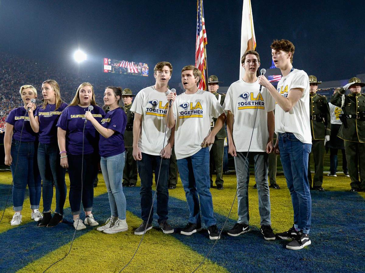 Members of the California Lutheran University choir sing the national anthem before Rams-Chiefs.