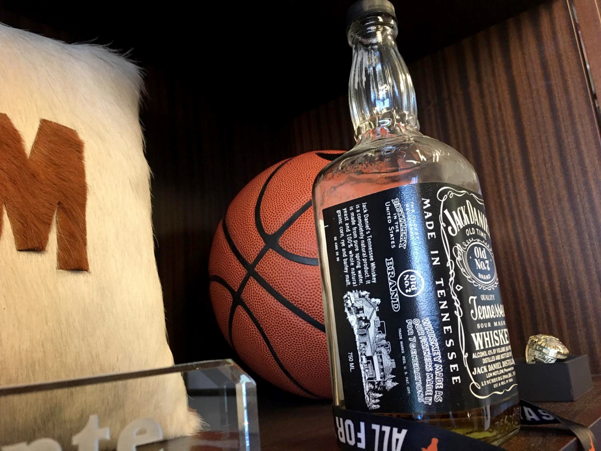 On a shelf in Texas athletic director Chris Del Conte's display cupboard is a mostly empty bottle of Jack Daniel's that belonged to Darrell Royal. Around these parts, it is a holy grail of sorts for the University of Texas.