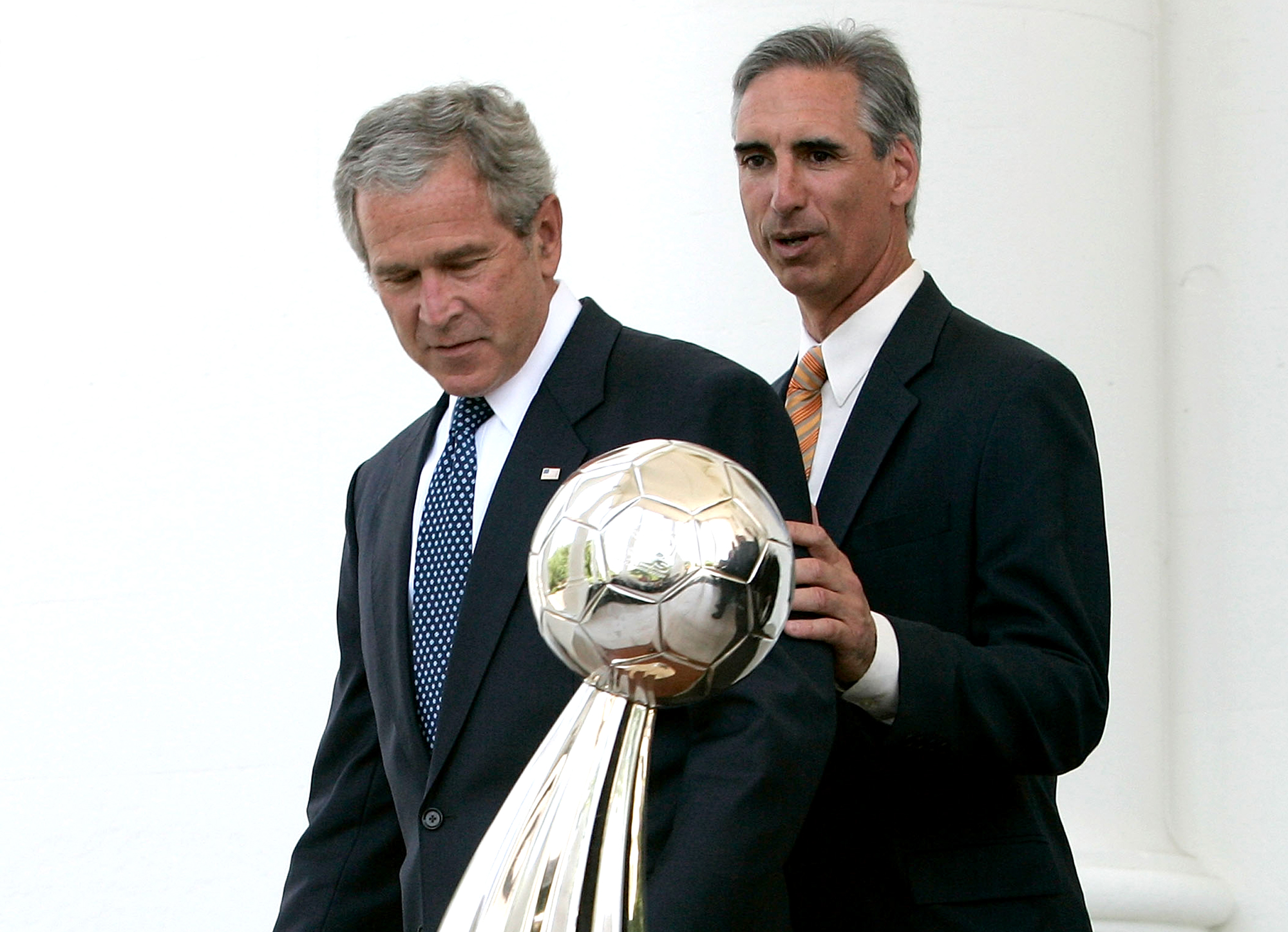 Luck and President George W. Bush with the Houston Dynamo’s 2006 MLS Cup trophy, one of two MLS titles the team won during Luck’s tenure as GM.  