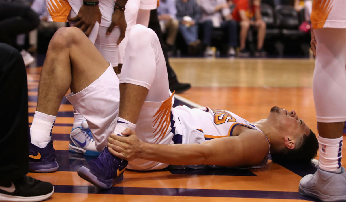 Devin Booker injury: Suns star sprained left ankle vs. Jazz - Sports
