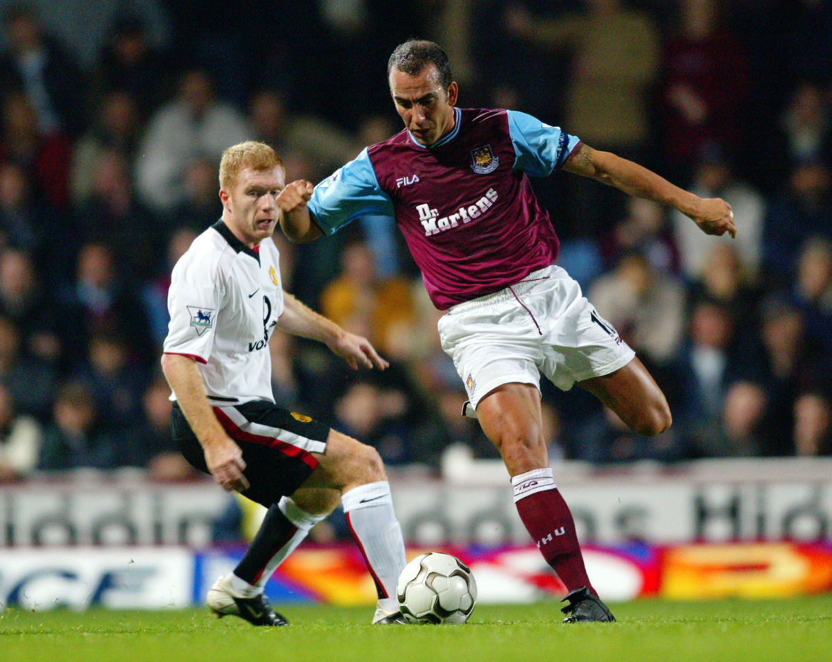 paolo-di-canio-of-west-ham-united-and-paul-scholes-of-manchester-united-5c952f0e75570fdfc4000001.jpg