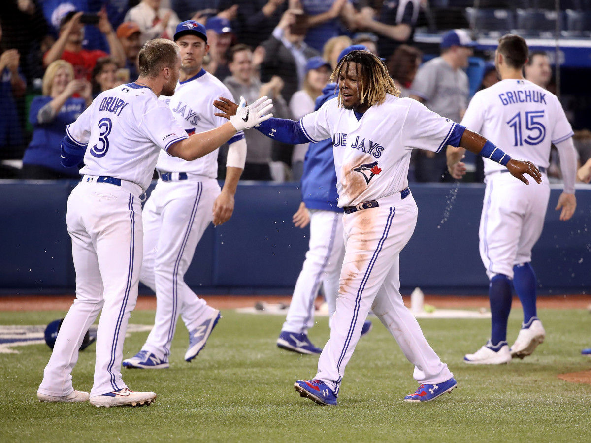 vlad-jr-celebrates-walk-off-with-drury.jpg