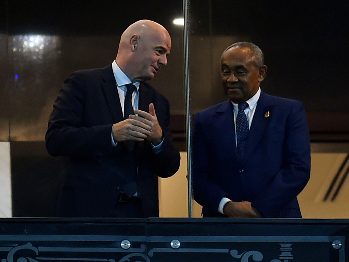 FIFA president Gianni Infantino, left, and Confederation of African Football president Ahmad Ahmad speak at the Africa Cup of Nations final.