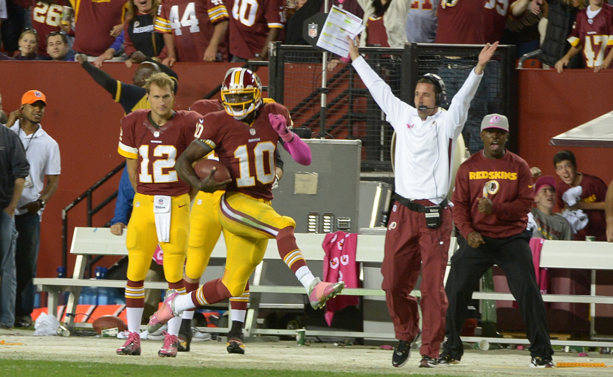 The good times rolled during RG3's rookie year, for the quarterback and the offensive cooridnator, Kyle Shanahan (in white).