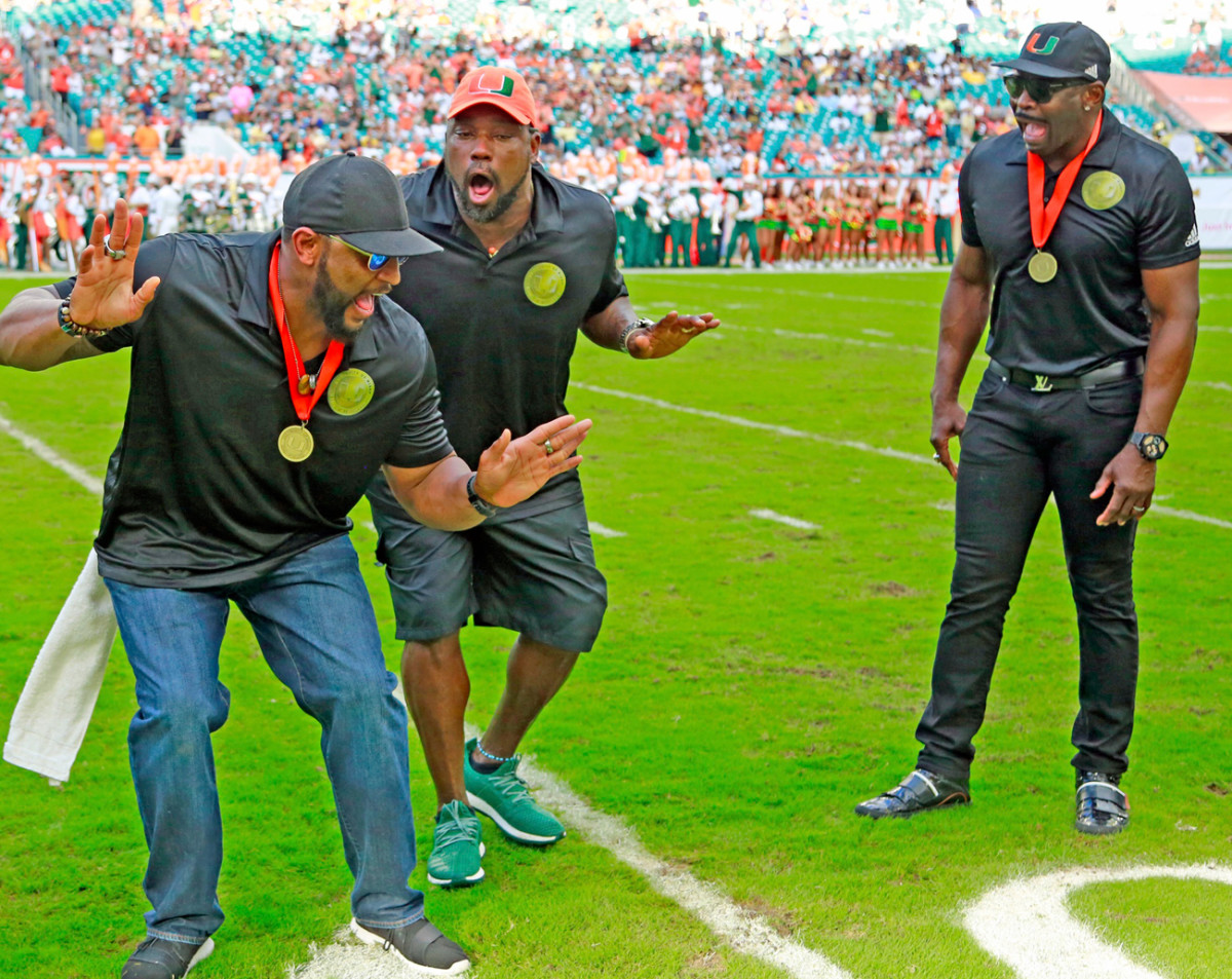 Sapp (center) with Ray Lewis and Michael Irvin at the October Ring of Honor ceremony.