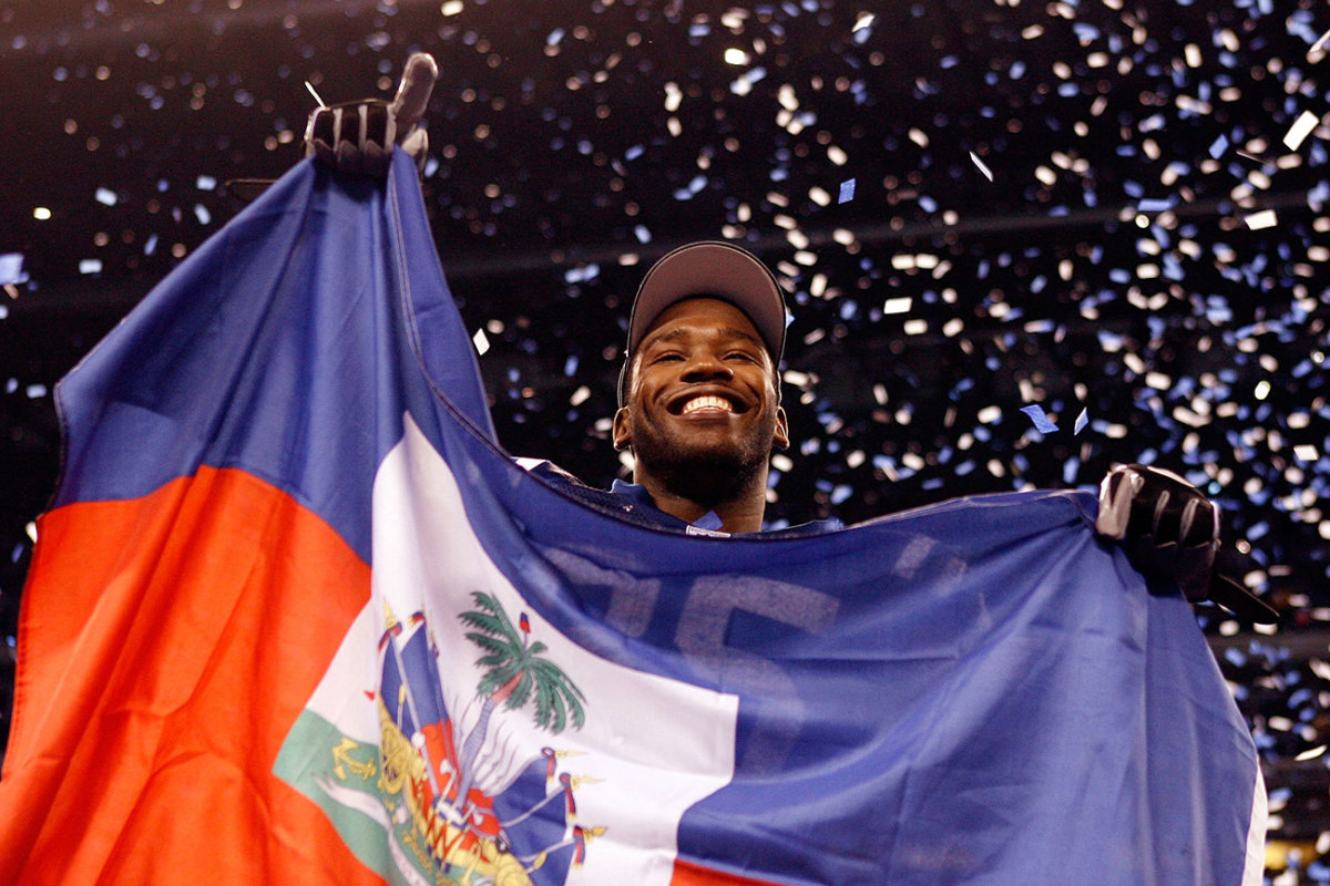 Pierre Garçon celebrates with the Haitian flag after the January 2010 AFC title game.