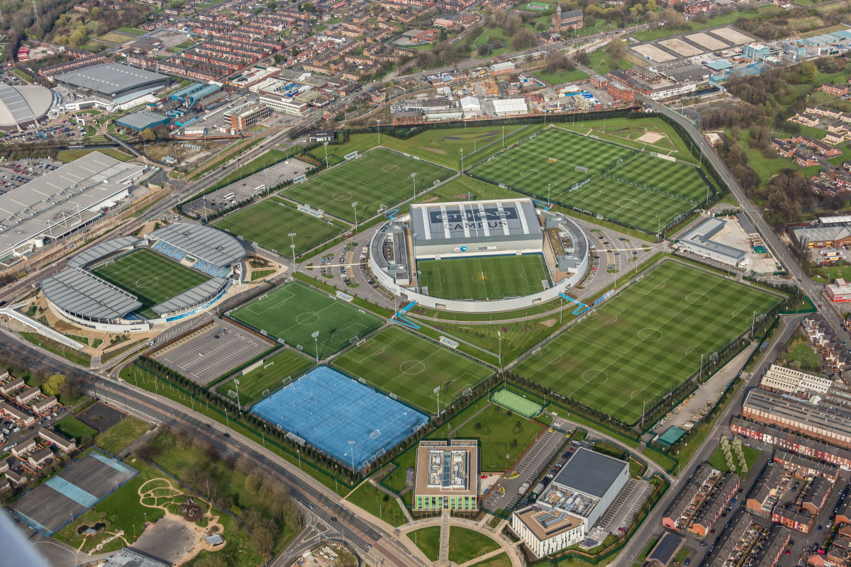 aerial-photograph-of-the-etihad-campus-training-ground-to-manchester-city-football-club-and-home-to-manchester-city-football-academy-5bcc575e3bf4c9c57e000001.jpg
