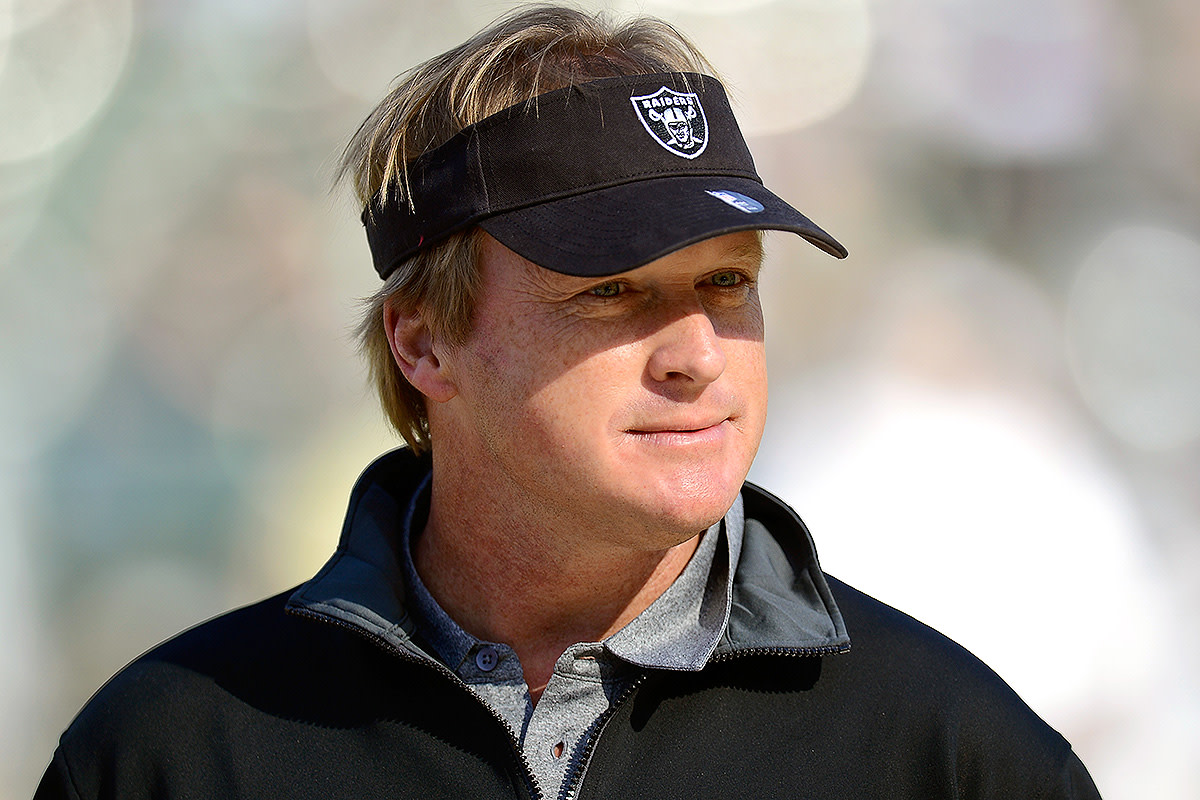 Jon Gruden watches pre-game warmups ahead of a Saints-Raiders game in 2012.