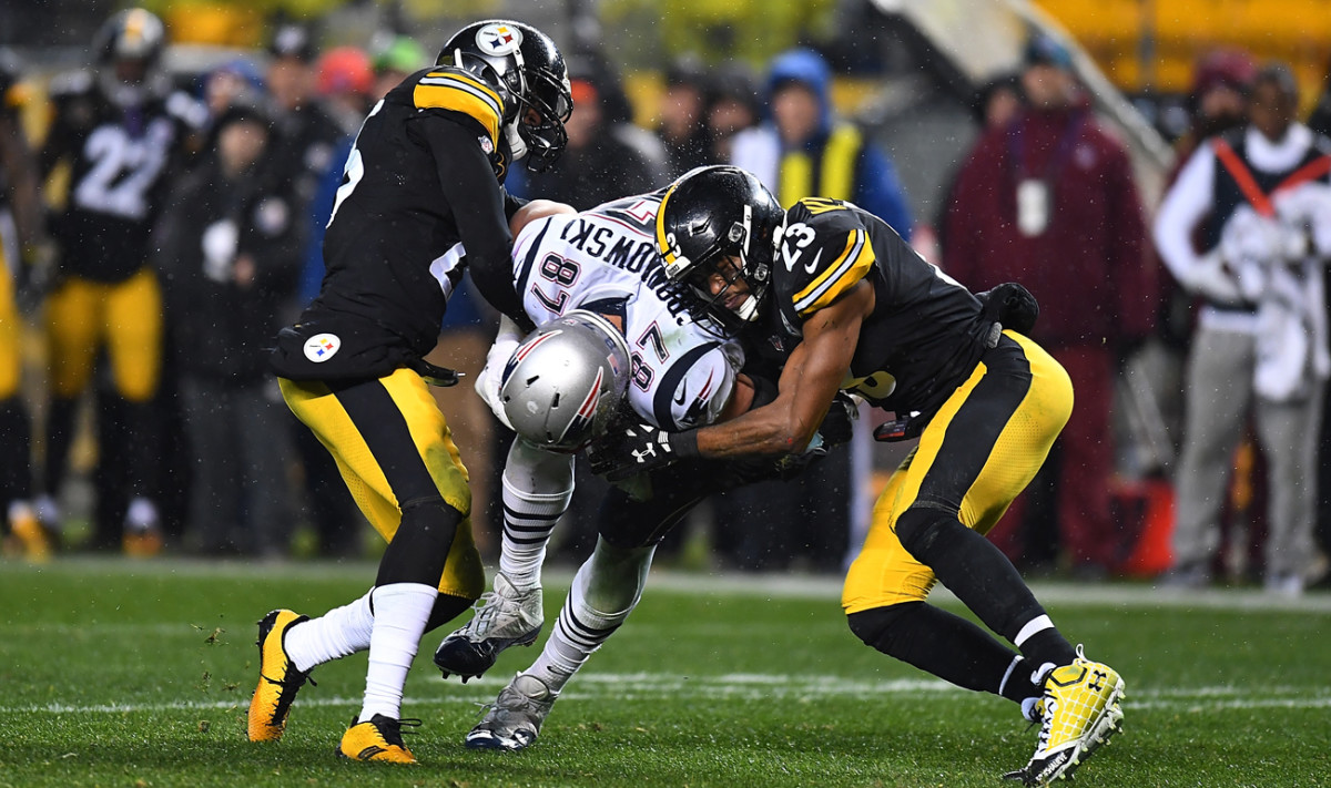 Mike Mitchell (23) and Artie Burns (25) wrap up Rob Gronkowski in Week 15. 