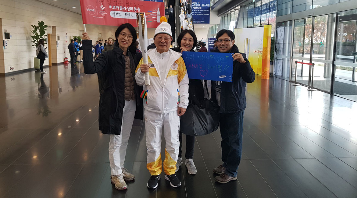 Kyung Soon Yim with the Olympic torch in the lead-up to the Olympics in PyeongChang.