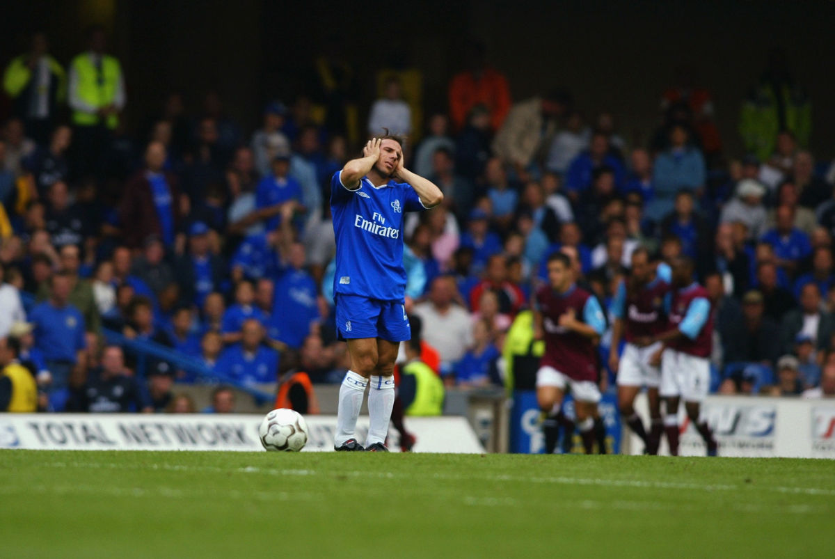 gianfranco-zola-of-chelsea-despairs-as-the-west-ham-united-team-celebrate-5bae3bfe14db2f908b000001.jpg