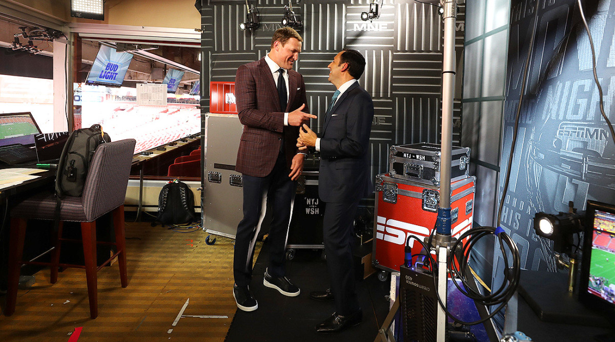 Jason Witten and ESPN play-by-play announcer Joe Tessitore (right) have a lighthearted moment before their broadcast.