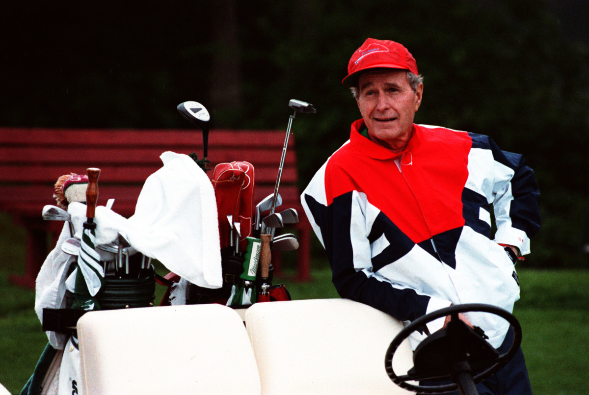 Bush with his golf clubs in 1991.