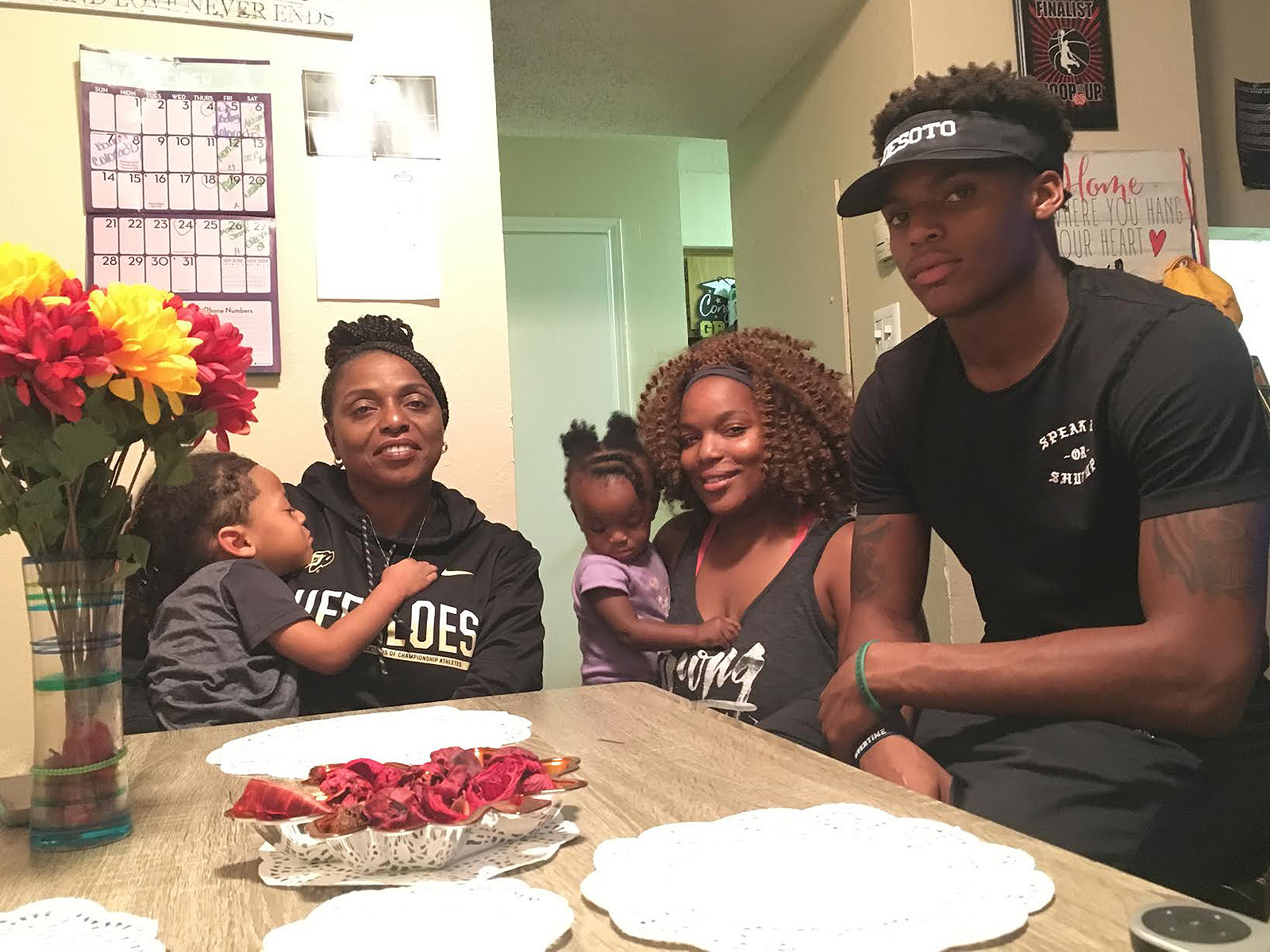 Laviska Shenault Jr.’s family sits around a small dining room table earlier this week in the Dallas suburb of DeSoto. Mom Annie, sister Tyanna and brother La’Vontae hold watch parties for Colorado games.