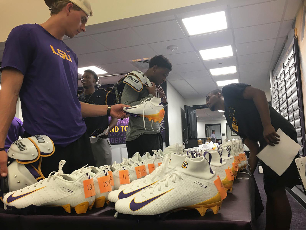LSU quarterback Myles Brennan selects his shoes for camp and this season on Friday.