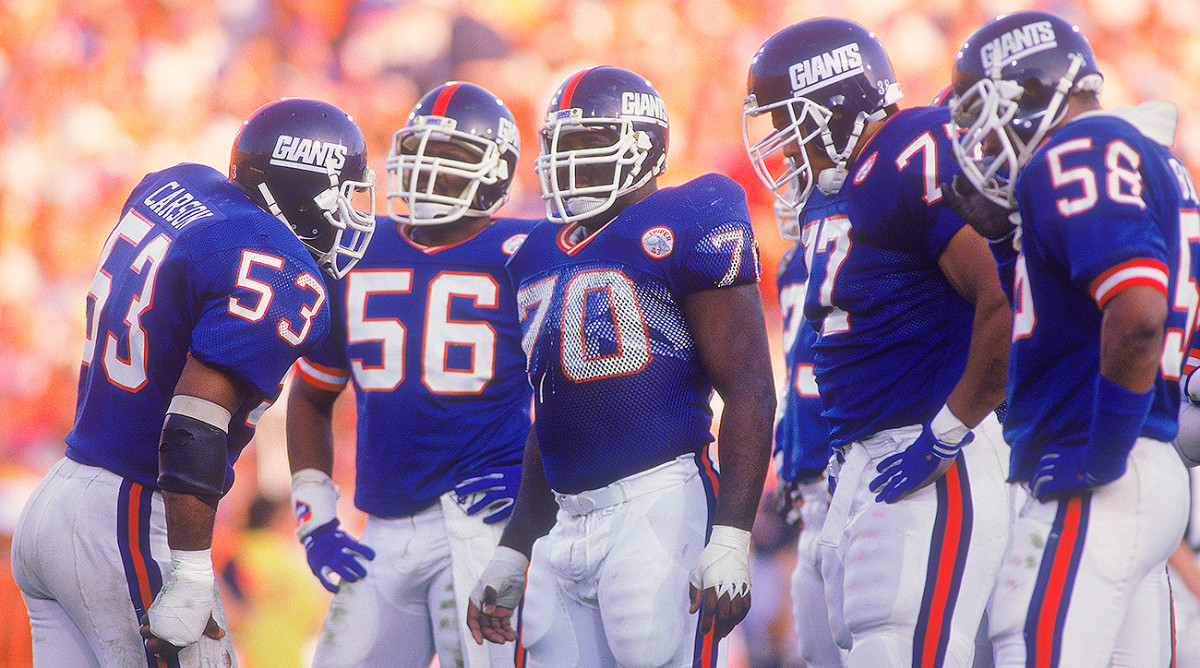 Harry Carson (left) and the Giants defeated the Broncos in Super Bowl XXI.