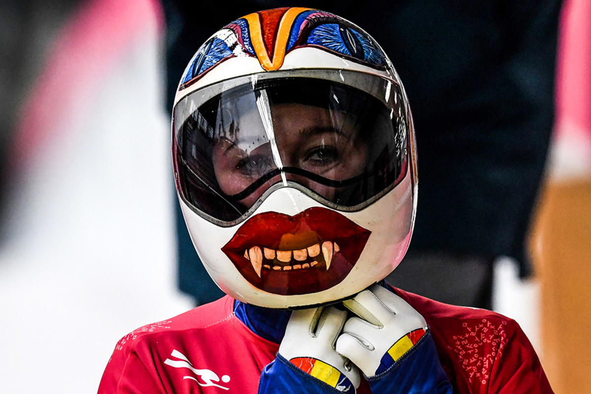 Romania's Maria Marinela Mazilu puts on her helmet to take part in the women's skeleton training session at the Olympic Sliding Centre during the Pyeongchang 2018 Winter Olympic Games in Pyeongchang on February 14, 2018.