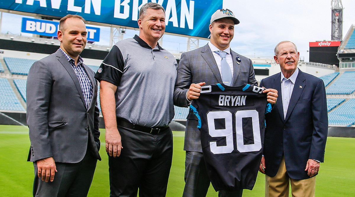 Jaguars GM Dave Caldwell, head coach Doug Marrone and VP of football operations Tom Coughlin stand with first-round draft pick Taven Bryan.