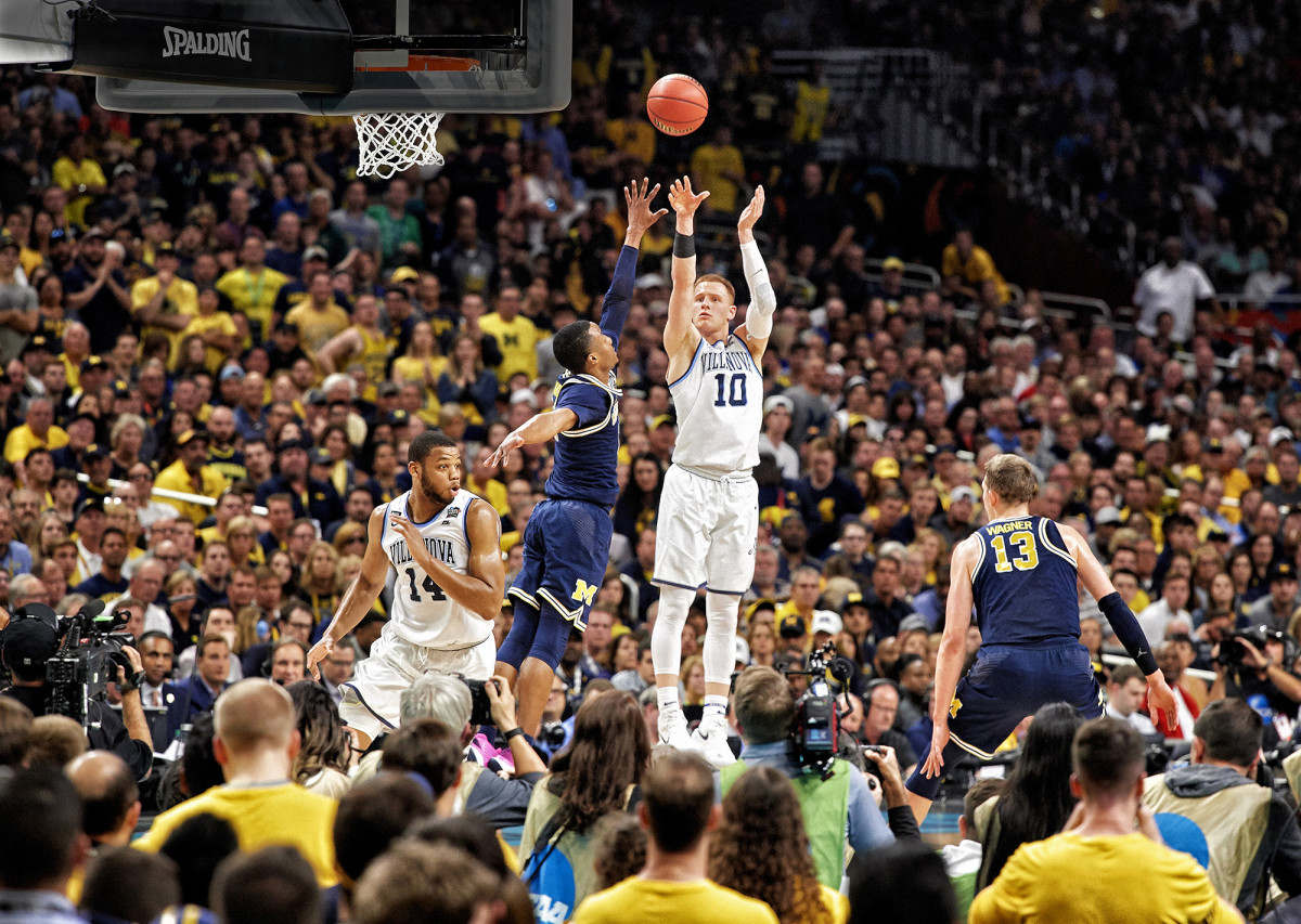 Villanova's Donte DiVincenzo shoots a three-pointer against Michigan in the NCAA tournament