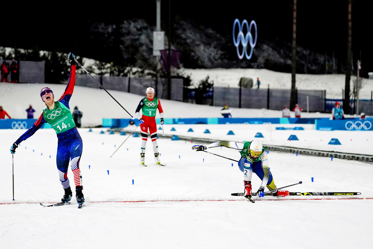 Jessie Diggins beats Stina Nilsson of Sweden to win gold in cross-country skiing team sprint for Team USA at the PyeongChang 2018 Olympics