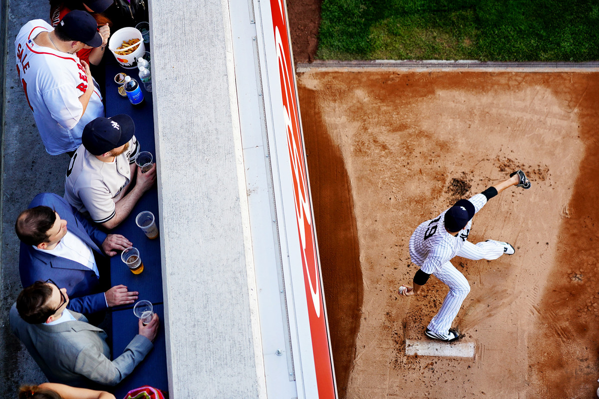 Yankees pitcher Masahiro Tanaka warms up during a game against the Red Sox