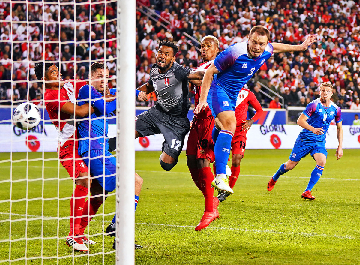 Iceland's Jon Gudni Fjoluson scores a goal vs. Peru during an international friendly