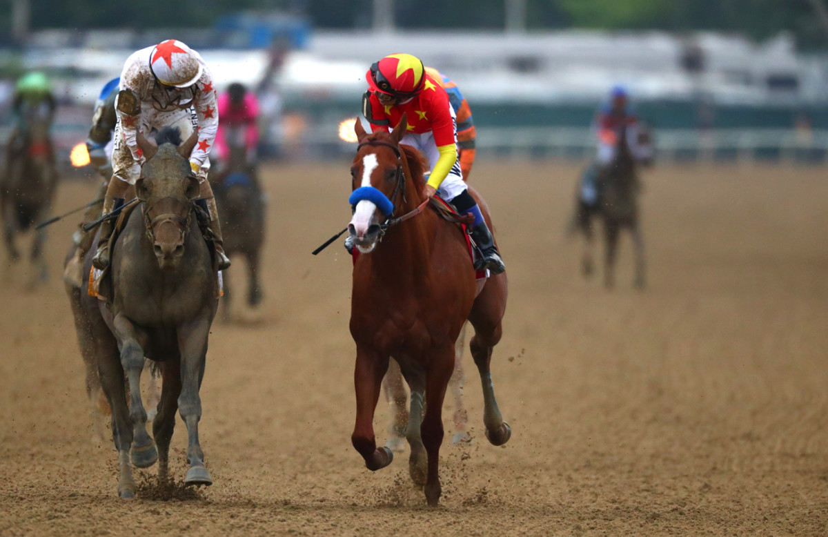 Jockeys exchange congratulations.