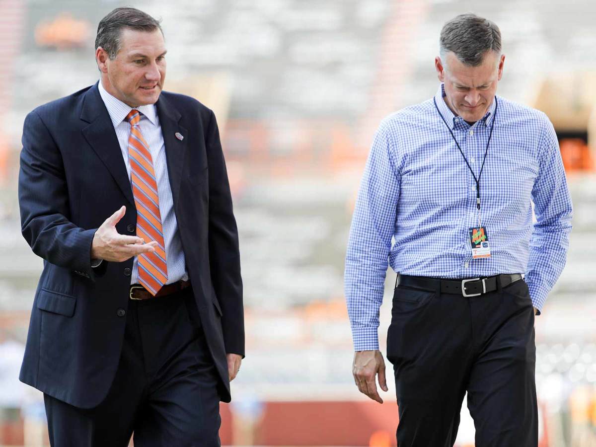 Dan Mullen and Scott Stricklin (right) were reunited in Gainesville last winter after working together in Starkville for nine years.