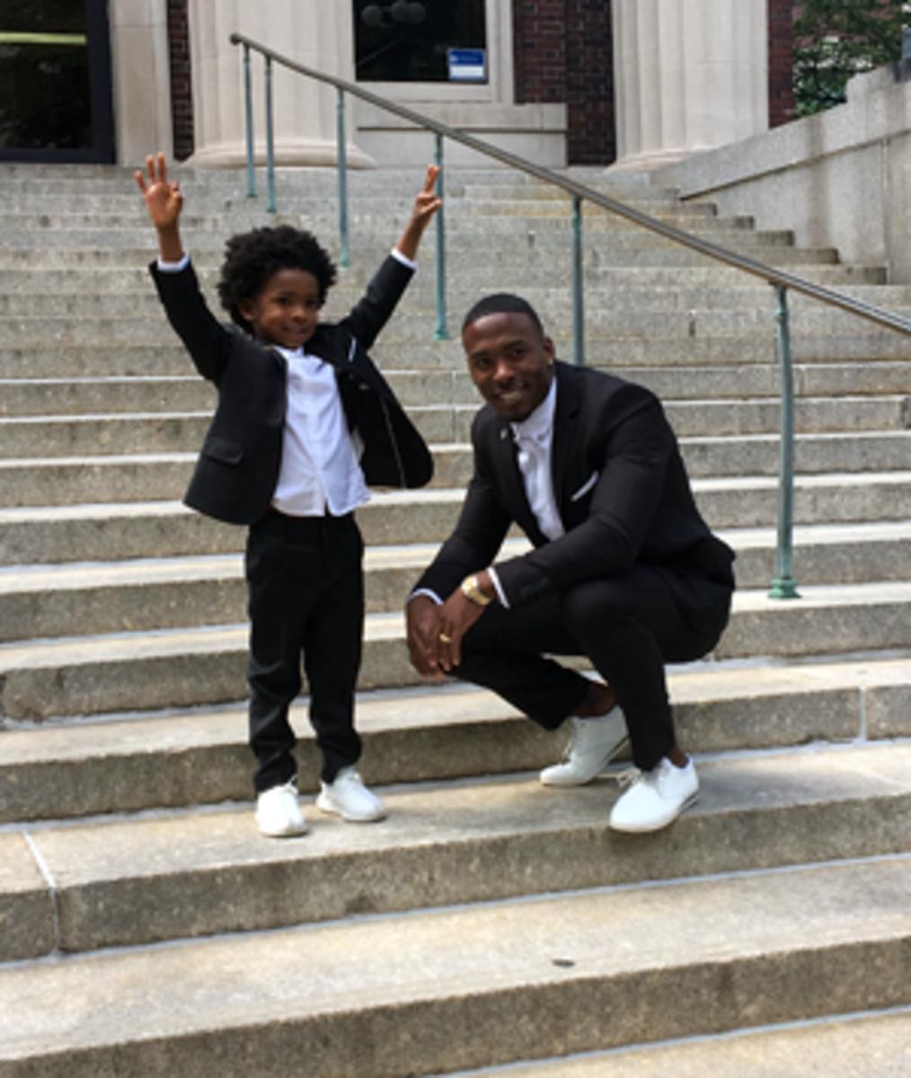 Andrew Hawkins and his 5-year-old son, Austin, at the Columbia graduation.