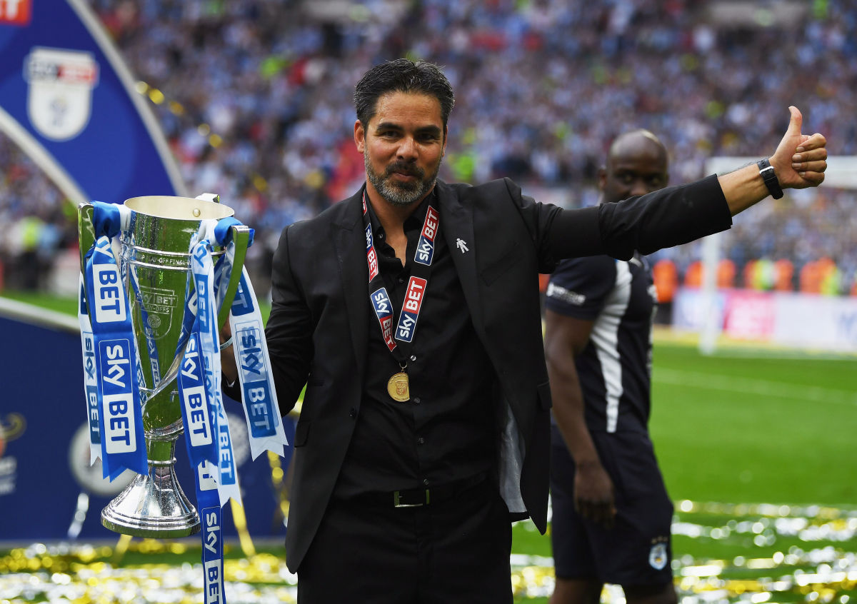 LONDON, ENGLAND - MAY 29: David Wagner, Manager of Huddersfield Town celebrates with The Championship play off trophy after the Sky Bet Championship play off final between Huddersfield and Reading at Wembley Stadium on May 29, 2017 in London, England.  (Photo by Gareth Copley/Getty Images)