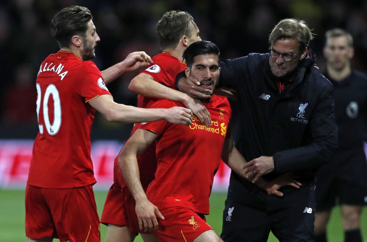 Liverpool's German midfielder Emre Can (C) celebrates with Liverpool's English midfielder Adam Lallana (L), Liverpool's Brazilian midfielder Lucas Leiva (2nd L) and Liverpool's German manager Jurgen Klopp after scoring the opening goal of the English Premier League football match between Watford and Liverpool at Vicarage Road Stadium in Watford, north of London on May 1, 2017. / AFP PHOTO / Adrian DENNIS / RESTRICTED TO EDITORIAL USE. No use with unauthorized audio, video, data, fixture lists, club/league logos or 'live' services. Online in-match use limited to 75 images, no video emulation. No use in betting, games or single club/league/player publications.  /         (Photo credit should read ADRIAN DENNIS/AFP/Getty Images)
