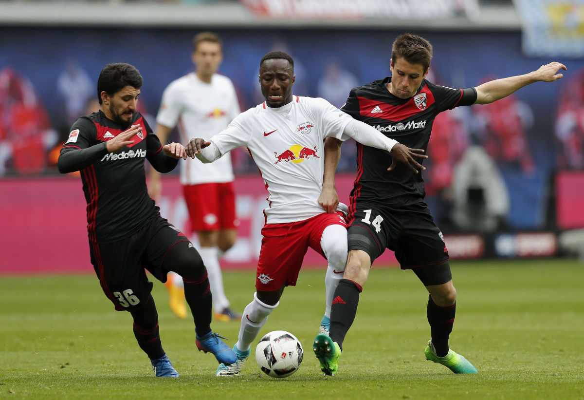 LEIPZIG, GERMANY - APRIL 29:  Naby Keita of RB Leipzig is challenged by Almog Cohen and Stefan Lex  of FC Ingolstadt 04 during the Bundesliga match between RB Leipzig and FC Ingolstadt 04 at Red Bull Arena on April 29, 2017 in Leipzig, Germany.  (Photo by Boris Streubel/Bongarts/Getty Images)