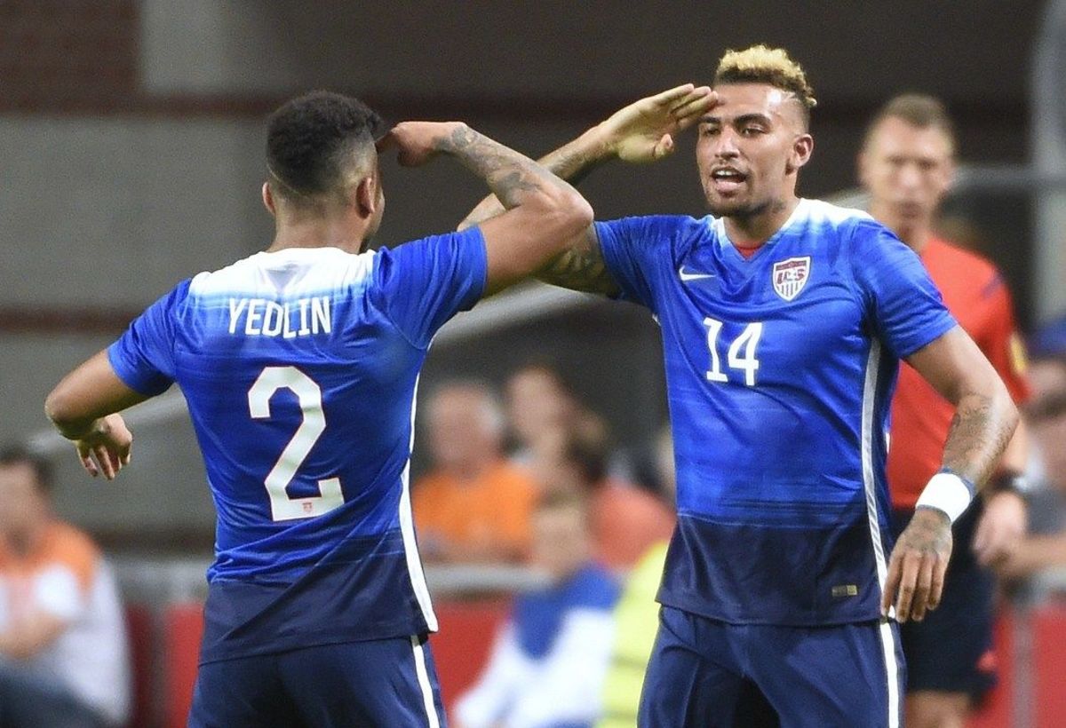 US Danny Williams (R) celebrates with US DeAndre Yedlin (L) after scoring a goal during the friendly football match between the Netherlands and USA on June 5, 2015 at the Arena Stadium  in Amsterdam. AFP PHOTO / JOHN THYS        (Photo credit should read JOHN THYS/AFP/Getty Images)