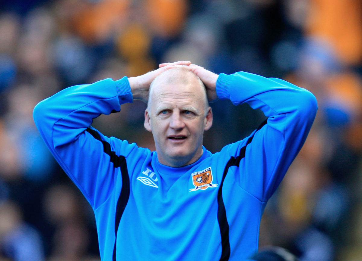 HULL, ENGLAND - MAY 9: Hull City interim manager Iain Dowie stands with his hands on his head during the Barclays Premier League match between Hull City and Liverpool at the KC Stadium on May 9, 2010 in Hull, England. (Photo by Jed Leicester/Getty Images)