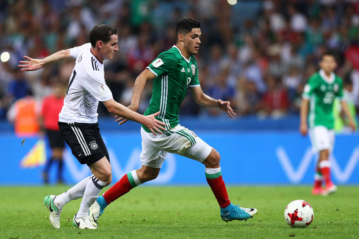 SOCHI, RUSSIA - JUNE 29:  Raul Jimenez of Mexico attempts to take the ball past Sebastian Rudy of Germany during the FIFA Confederations Cup Russia 2017 Semi-Final between Germany and Mexico at Fisht Olympic Stadium on June 29, 2017 in Sochi, Russia.  (Photo by Buda Mendes/Getty Images)