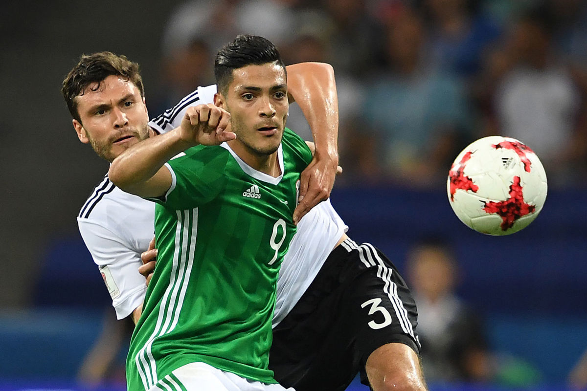 TOPSHOT - Mexico's forward Raul Jimenez (R) challenges Germany's defender Jonas Hector during the 2017 FIFA Confederations Cup semi-final football match between Germany and Mexico at the Fisht Stadium in Sochi on June 29, 2017. / AFP PHOTO / Kirill KUDRYAVTSEV        (Photo credit should read KIRILL KUDRYAVTSEV/AFP/Getty Images)