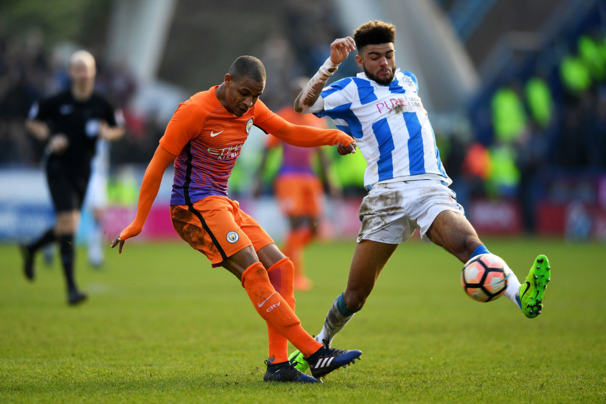 HUDDERSFIELD, ENGLAND - FEBRUARY 18: Philip Billing of Huddersfield Town (R) attempts to block Fernandinho of Manchester City (L) cross during The Emirates FA Cup Fifth Round match between Huddersfield Town and Manchester City at John Smith's Stadium on February 18, 2017 in Huddersfield, England.  (Photo by Gareth Copley/Getty Images)