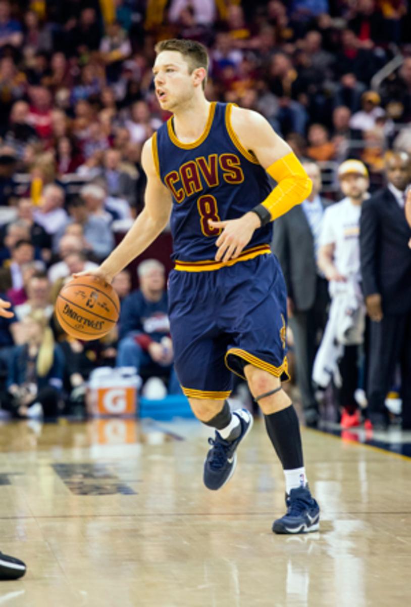 Matthew Dellavedova, wearing a WHOOP device on his left wrist, runs the point for the Cavs in March 2016.