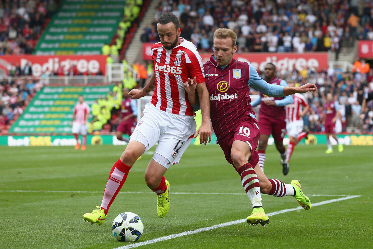 STOKE ON TRENT, ENGLAND - AUGUST 16: Marc Wilson of Stoke City in action with Andreas Weimann of Aston Villa during the Barclays Premier League match between Stoke City and Aston Villa at Britannia Stadium on August 16, 2014 in Stoke on Trent, England.  (Photo by Clive Brunskill/Getty Images)