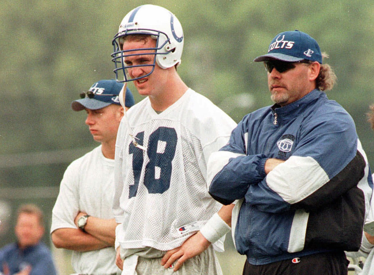 Peyton Manning and Bruce Arians (right) watch Colts practice during the team's minicamp in 1998.